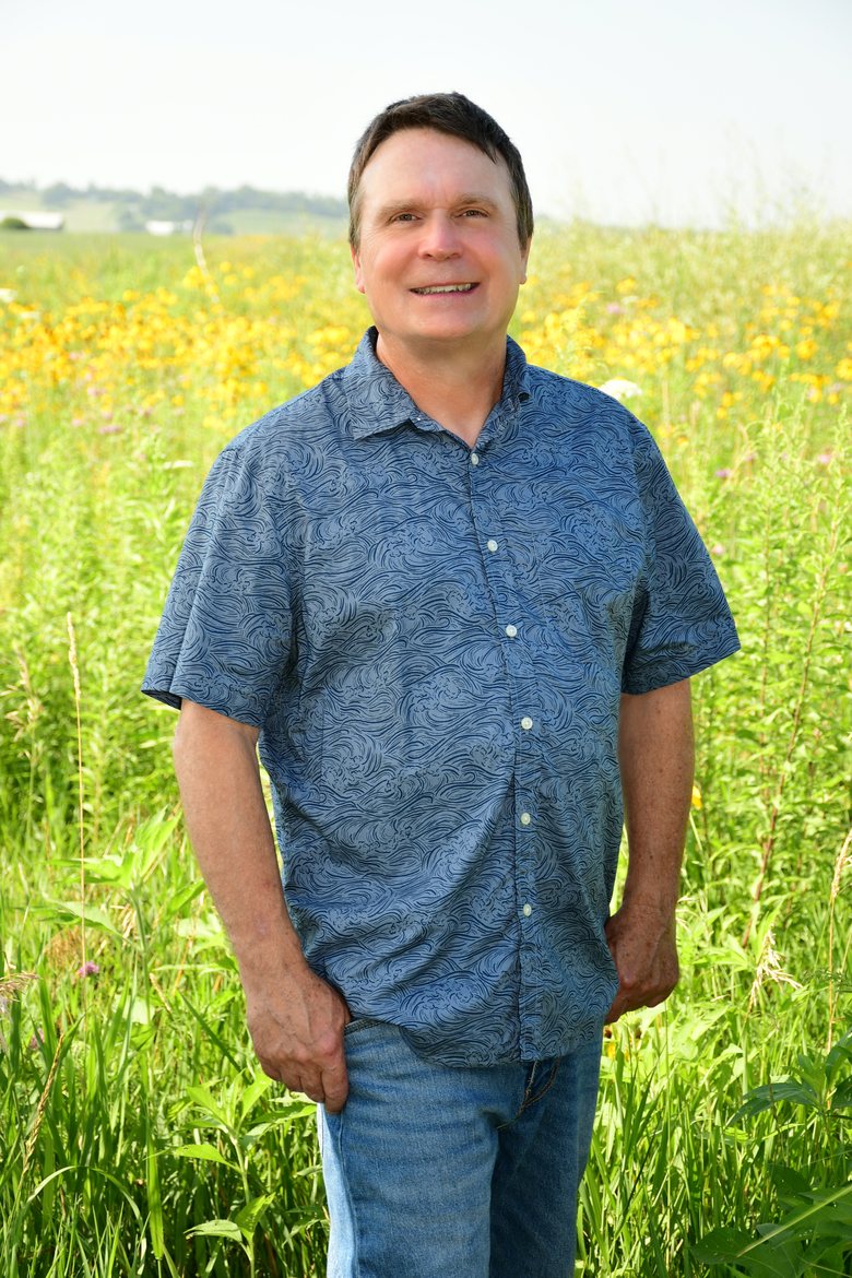 Mark Divitt in an Iowa wildflower field